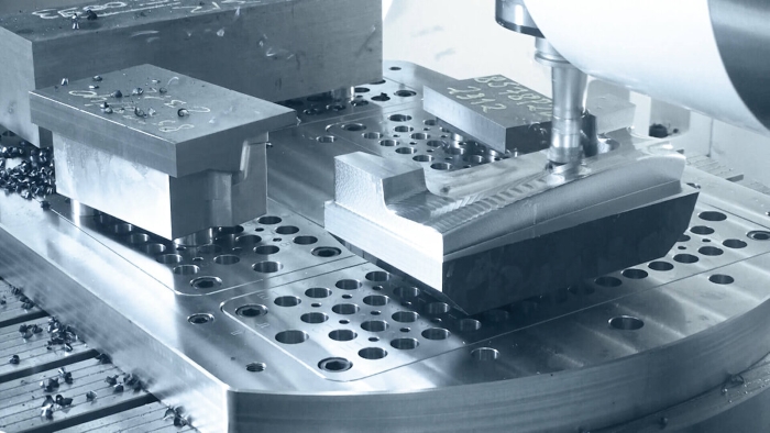 A CNC machine operating with multiple setups